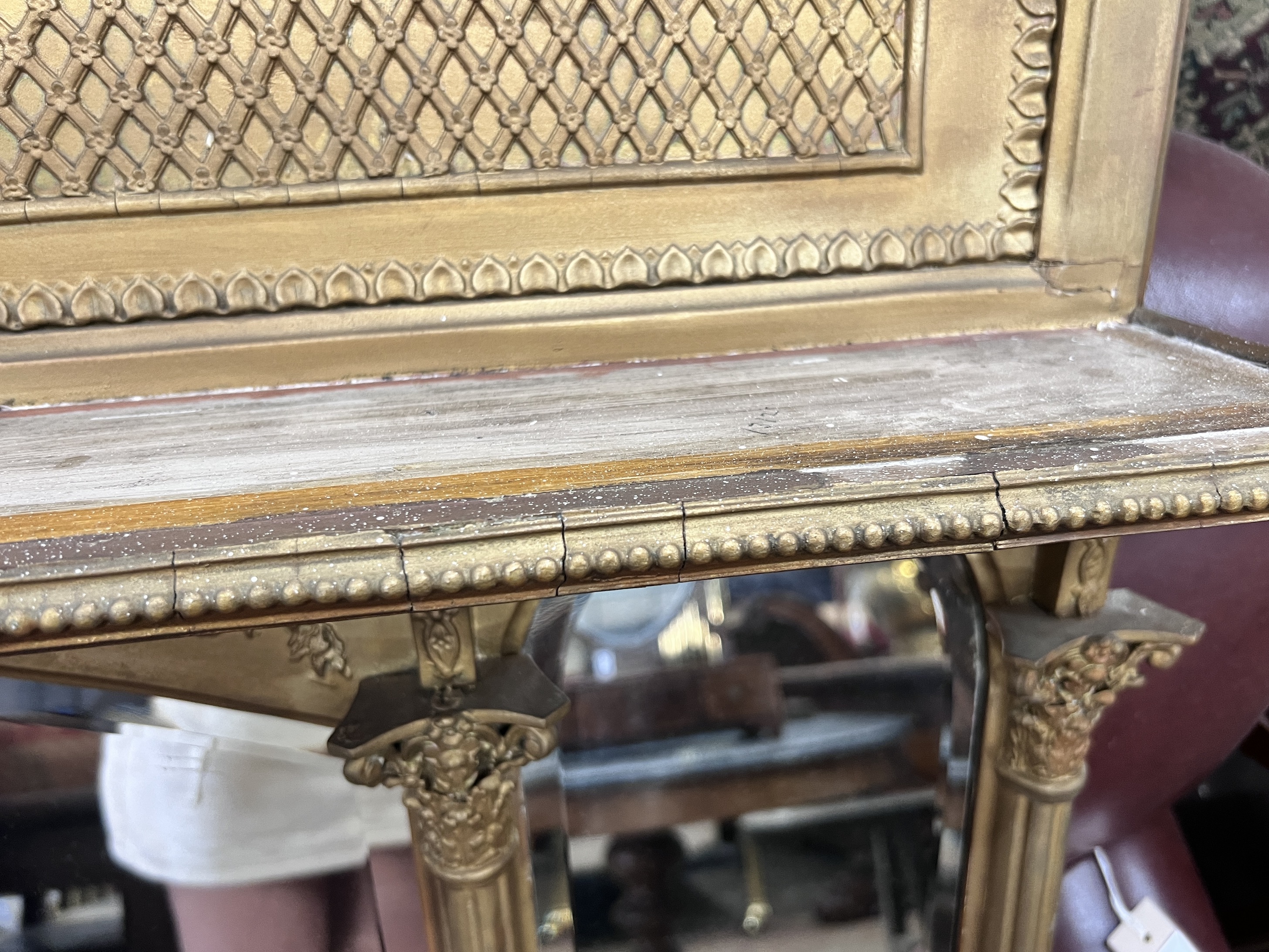 A late Victorian giltwood and composition triple plate overmantel mirror, width 144cm, height 85cm